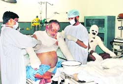 Injured fireman Rajesh Kumar (left) and Pawan Kumar (right) being treated at CMCH, Ludhiana