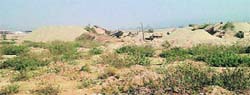 Illegal mining underway near a railway bridge on the Pathankot-Jammu section.