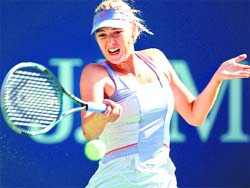 Maria Sharapova fires a return against Heather Watson in the US Open on Monday. AFP
