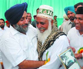 Sukhbir gives a hug to a member of the Muslim community on Id-Ul-Fitr in Bathinda on Wednesday.