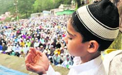 A child offers prayers on Eid-ul-Fitr in Shimla