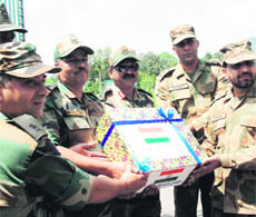 Indian and Pakistan troops exchange sweets at Chakkan-Da-Bagh along the LoC in Poonch district 