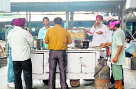 Despite the ban on the cooking of food at the railway station, vendors prepare poori-chhole on an LPG stove at a platform in Amritsar