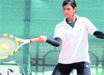A player returns a shot during the Manav Mangal AITA Talent Series Tennis Tournament in Chandigarh 