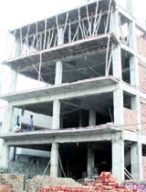 A commercial building under construction in Rohtak in gross violation of building bylaws.