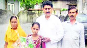 Mamta and her parents with MLA Rakesh Pathania in Nurpur.