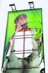 A torn portrait of Gaddafi is seen in Tripoli