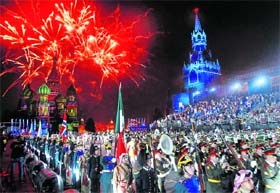 Colourful show: Participants leave the Red Square after performing at the International Military Music Festival Spasskaya Tower at the Red Square in Moscow on Wednesday