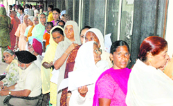 Women queue up to get themselves registered at DAC, Mohali, on Friday
