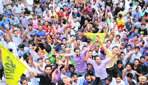 Pushpinder Sharma, the newly elected president of Panjab University Student Council, celebrate with supporters on the campus on Friday