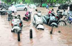 Vehicles stalled in rainwater on the road separatiing Sectors 18 and 19 in Chandigarh on Friday