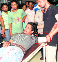 Sourav Malik (bandaged arm encircled) at the Sector-16 hospital after the incident on Thursday night
