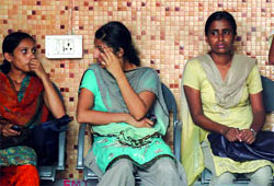 Relatives and friends grieve at the Govindpuri mortuary in south Delhi where the postmortem of employees of Muthoot Finance company is being conducted on Friday. Two employees were shot dead by the companys security guard. 