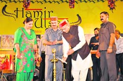 Chief Minister PK Dhumal lights the traditional lamp to inaugurate the Hamir Utsav in Hamirpur 