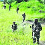 Army personnel rush to the scene of an encounter in Handwara on Friday.