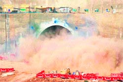 A blast being triggered inside the under-construction Chenani-Nashri tunnel on the Jammu and Kashmir highway on Friday. 