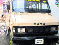 A old van, which is being used to ferry schoolchildren, outside a school at Jagraon