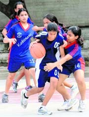 Players in action during a basketball match in Chandigarh on Saturday.