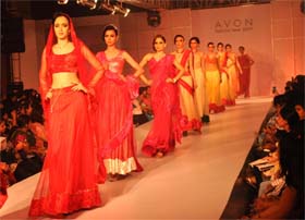 Models walk on the ramp during a fashion show organised by Avon Fashion Tour in Gurgaon on Saturday