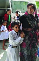 Schoolchildren of Sarvodaya Kanya Vidyalaya, Uttam Nagar, being taken to hospital after the midday meal in New Delhi on Saturday. 