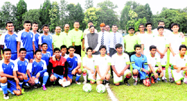 Chief Minister Ramesh Pokhriyal Nishank with the RIMC (in blue) and Selaqui International School teams during the inauguration of the RIMC Soccer Tournament in Dehradun on Saturday