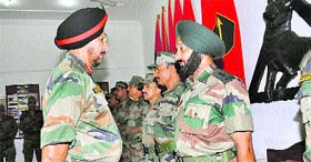 Maj-Gen TPS Waraich, General Officer Commanding of the Tiger Division, felicitates gallantry award winners in Jammu on Saturday.
