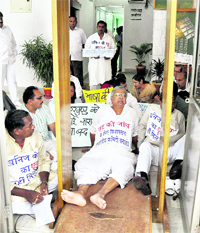 Opposition MLAs block the entrance to the Jharkhand Assembly to protest against the alleged loot of minerals in the state, in Ranchi on Saturday