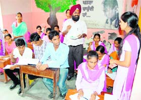 Master Ajit Singh teaches students at Citizen Forum Vidya Mandir at Maqboolpura in Amritsar