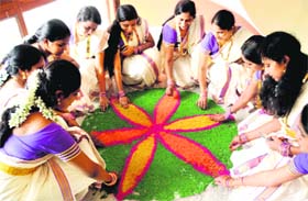 Women from Kerala make a rangoli to mark Onam celebrations in Sector 19, Chandigarh, on Sunday