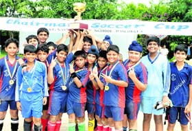 Winners strike a pose with their trophy in Panchkula