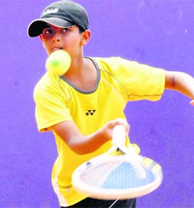 Daksh plays a shot during a tennis match in Chandigarh on Sunday