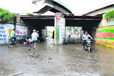 Commuters face a tough time trying to cross Domoria RUB in Jalandhar. 