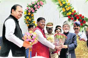 Jharkhand Chief Minister Arjun Munda greets Syed Ahmad after he took oath as the eighth Governor of the state during a ceremony at the Raj Bhawan in Ranchi on Sunday. Union Tourism Minister Subodhkant Sahay is also seen in the picture. Ahmad replaces MOH Farook, who is scheduled to take charge as the Governor of Kerala. Ahmad, a well-known poet and author of many books, has been associated with the Congress since 1977 and has represented Mumbais Nagpada constituency for five terms.