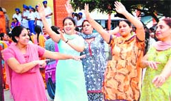 Staff of Shri Guru Harkrishan Public School perform giddha during the Teachers Day function at the school in Amritsar