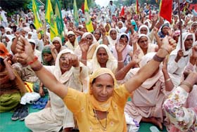 Agricultural workers and the families of farmers and farm labourers who committed suicide, stage a protest in Bathinda on Monday