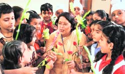 Principal of DAV School, Sector 15, get flowers from the students in Chandigarh on Monday. 