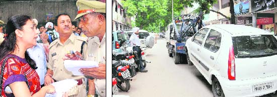 A woman reasons with a police official for issuing her a challan despite being issued a ticket by the parking staff on the bridge road in Sector 17, Chandigarh; and (right) an illegally parked car being towed away by the traffic police on Monday.