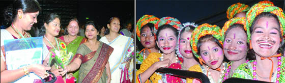 Teachers greet each other after receiving State Teacher Award 2011; (Right) schoolchildren participate at the award funtion at Thyagraj Stadium in New Delhi