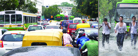 A long traffic jam at Connaught Place in New Delhi on Monday. Tribune Photo (Right) Schoolchildren enjoy in the rain in New Delhi 