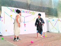 Students of the Institute of Information Technology for the Tribes of India stage a play on Teachers Day in Dehradun. 