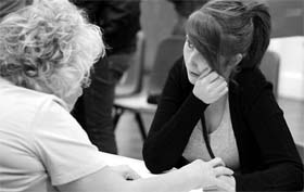 An A-level student in UK is comforted after receiving her results