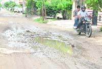 A damaged road in Sector 9 in Ambala City.