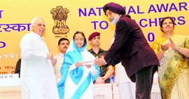 Dr GS Dhillon, Principal, Dalhousie Public School, receives the national award for meritorious teacher from President Pratibha Devisingh Patil in New Delhi on Monday.