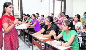 Priyanka Malik, a student of MSc (IT) of Prem Chand Markanda SD College for Women, teaches BCA students on Teacher's Day.