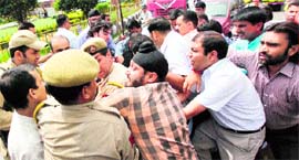 Activists of the Bharatiya Janata Yuva Morcha scuffle with the police in Jammu on Monday.