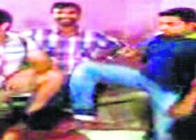 An MMS grab showing Talli being kicked by a rival