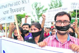 Guest lecturers stage a dharna in support of their demands on the occasion of Teacher's Day in Patiala on Monday