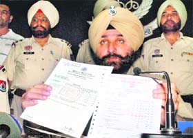 SSP Gurpreet Singh Gill shows fake degrees in Patiala on Monday