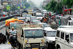 Commuters negotiate the bumper-to-bumper traffic near the Fauji Chowk in Bathinda 