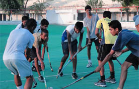 Budding hockey players line up for a practice session in Ferozepur. 